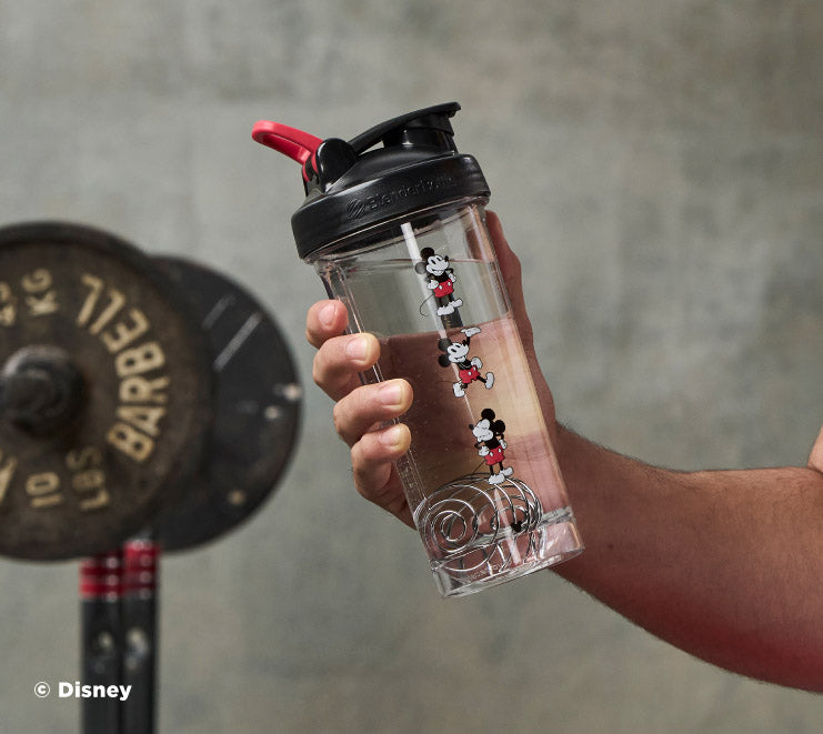 pro-series-r3 Mickey_Mouse_Protein_Shaker_Bottle_Being_Held_In_the_Gym.jpg